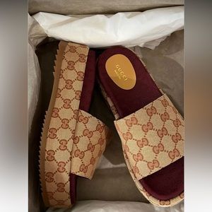 Like Gucci slides. Size 9. Worn once. Excellent condition.
